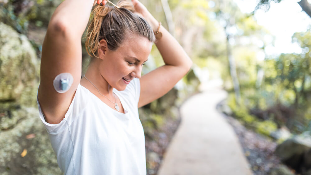 Person exercising outdoors, managing type 2 diabetes through a healthy and active lifestyle